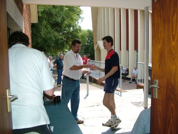 Deon Davie collects his prizes and is thanked by Corrie van Staden (left)