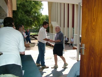 Cedric Aron collects his prizes and is thanked by Corrie van Staden (left)