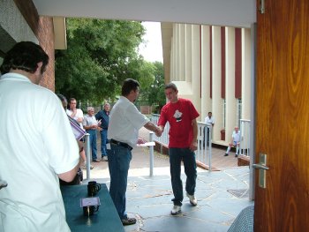 David Jooste, Jooste and Son, collects his prizes and is thanked by Corrie van Staden (left)