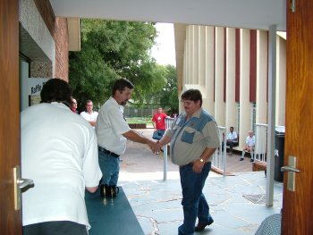 Frank Gerber collects his prizes and is thanked by Corrie van Staden (left)