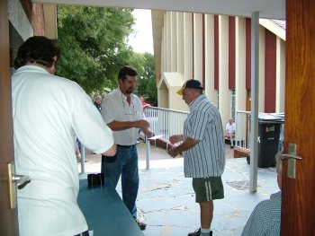 Ralph Morgan collects his prizes and is thanked by Corrie van Staden (left)