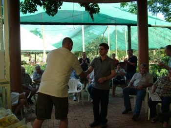 Roy Bennett of Sunward Aviaries collects his awards