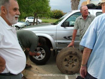 Glen Furniss changes a flat which was discovered when they were ready to leave.