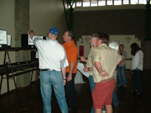 Pierre Swart judging the Spangles with trainee judge Ian Nel - Free State Rare and Spangle Show 2015