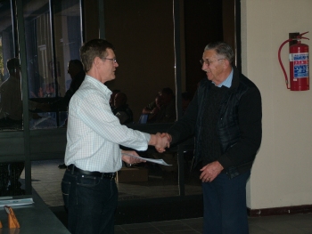 Roy Bennett hands over the Best Bird on Show award to Chris Oberholzer