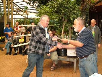 Russel Clements receives his awards from Mike Davies