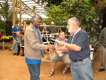 Raj Naicker receives his awards from Mike Davies