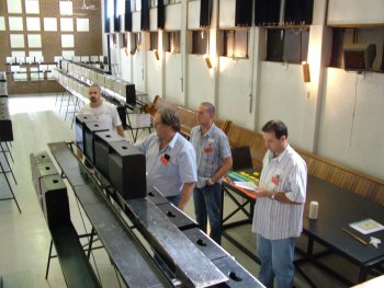 George Sutton judging with stewards looking on.