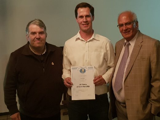 Deon Davie (Center) receives his 30 Year membership certificate from Carlos Ramoa, WBO Chairman, and Ghalib Al-Nasser, WBO Secretary.