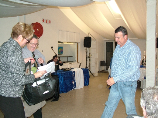 Glen Furniss collects his prizes for winning Best Opposite Sex on Show.