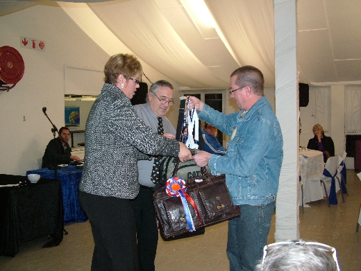 Holger Molkentin (Molkentin Stud) collects the awards for winning Best Bird on Show.
