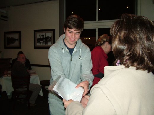 Ryan van der Heever receives his awards and the Best Albino on Show Challenge Certificate.