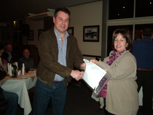 Johan vd Merwe receives the Challenge Certificate for Best Violet on Show from Elke de Witt.