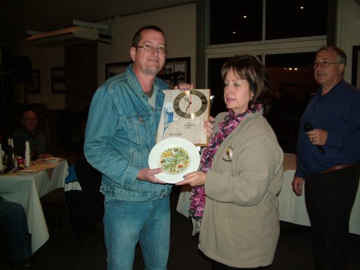 Holger Molkentin, Molkentin Stud, receives the Best Bird on Show and Best Champion on Show as well as Challenge Certificates for Best Grey, Cinnamon Blue, Best Spangle Green, Best Double Factor Spangle, Best Lutino and Best Dominant Pied from Elke de Witt.