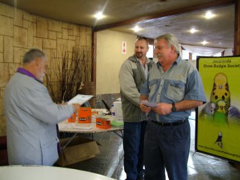 Mike Davies (L) reads out all the awards won by Gert Pieters (R) while Ian looks on.