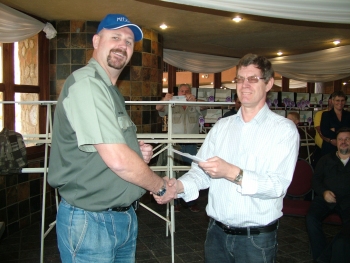 Roy Bennett (Sunward Aviaries) collect his prizes